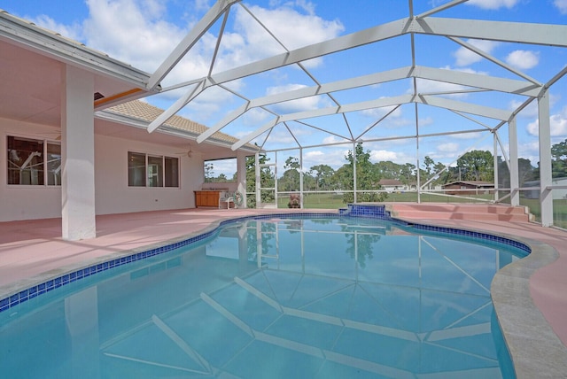 view of pool with a lanai and a patio