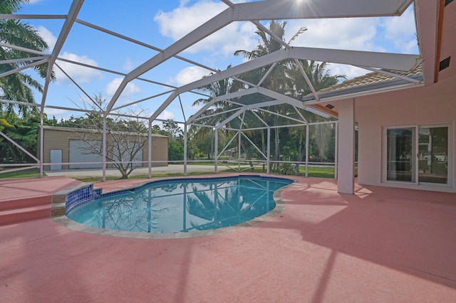 view of pool featuring a lanai and a patio