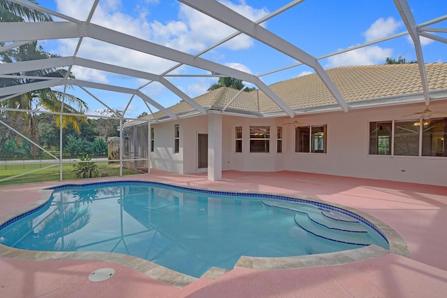 view of pool featuring a lanai, ceiling fan, and a patio area