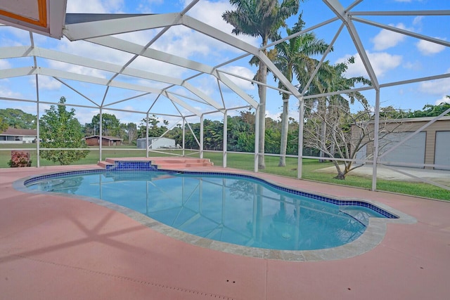 view of swimming pool with a jacuzzi, a patio area, and glass enclosure