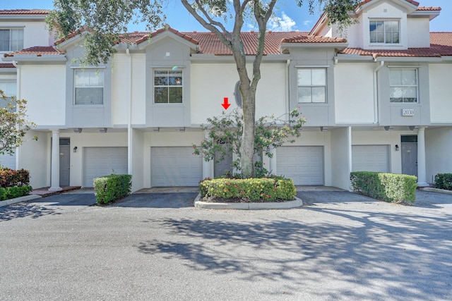 townhome / multi-family property featuring a garage