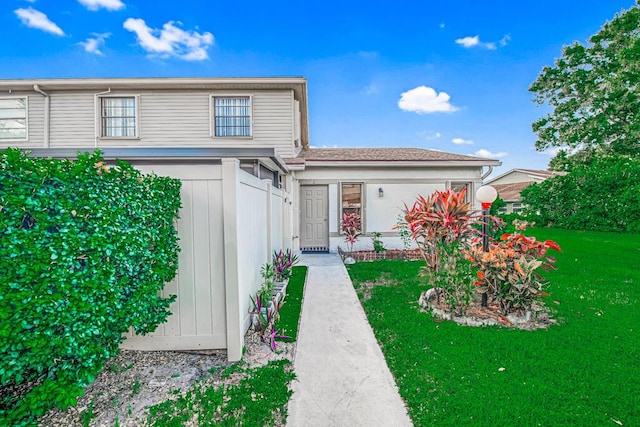 view of property with a front lawn