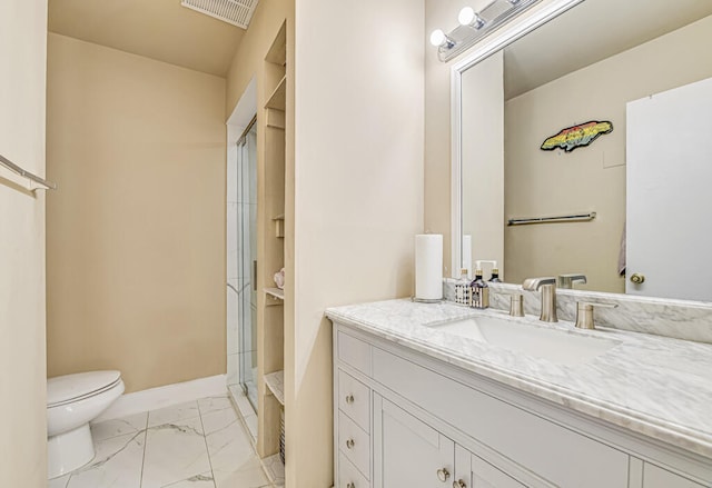 bathroom with a shower with door, toilet, and vanity