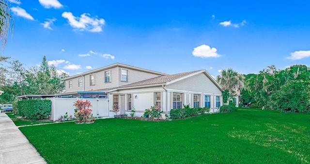 view of property featuring a front yard