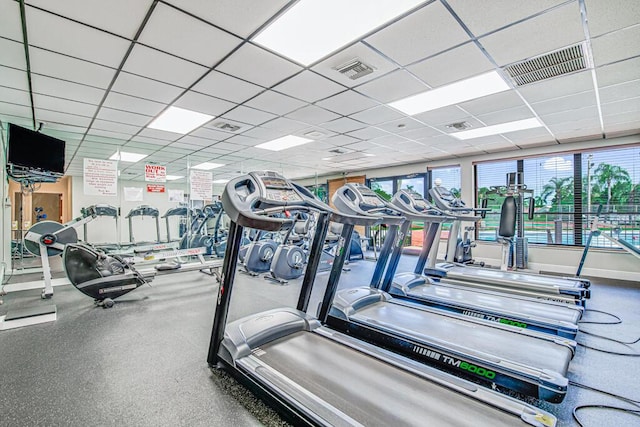 exercise room featuring a paneled ceiling