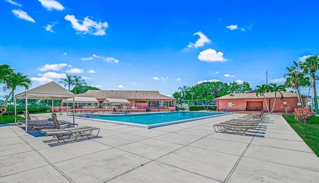 view of swimming pool with a patio