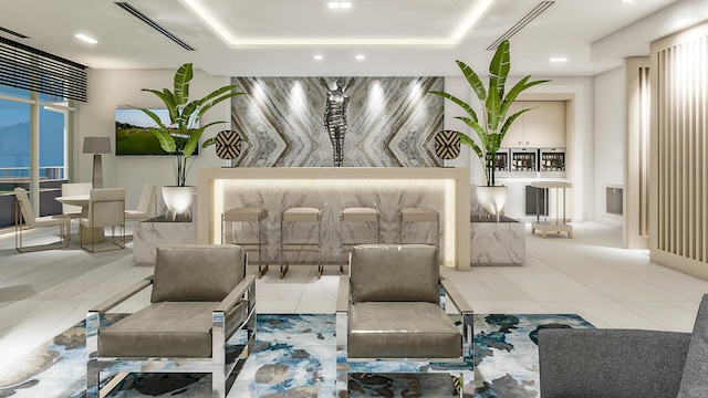 bedroom with a tray ceiling and light tile patterned floors