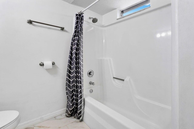 bathroom with toilet and shower / bath combination with curtain