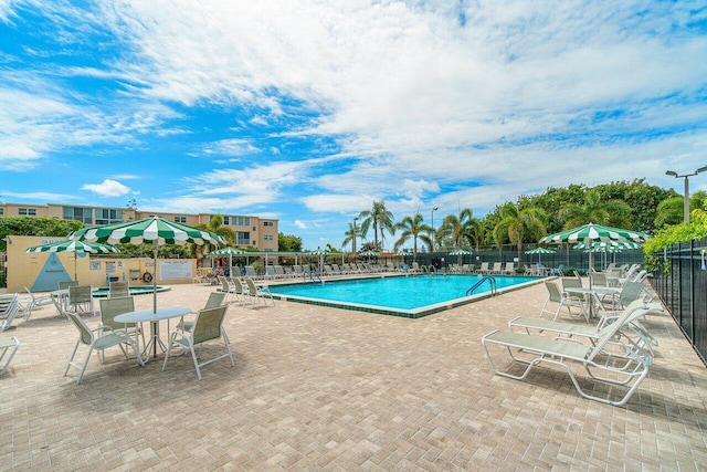 view of swimming pool featuring a patio area