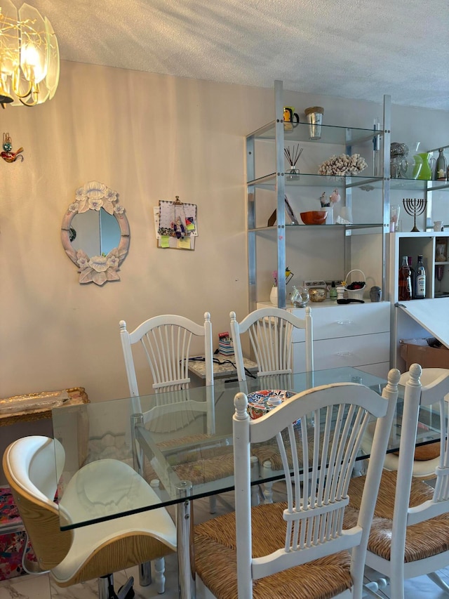 dining area featuring a textured ceiling