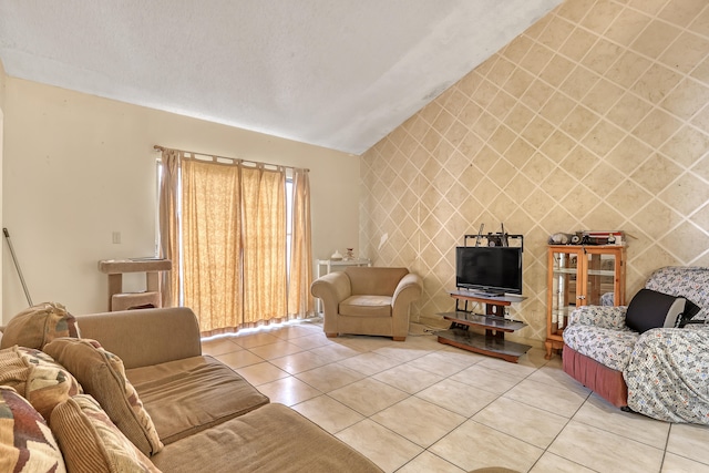 living room with tile patterned floors and vaulted ceiling