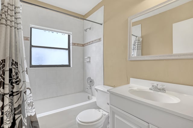 full bathroom with shower / bath combination with curtain, toilet, and vanity