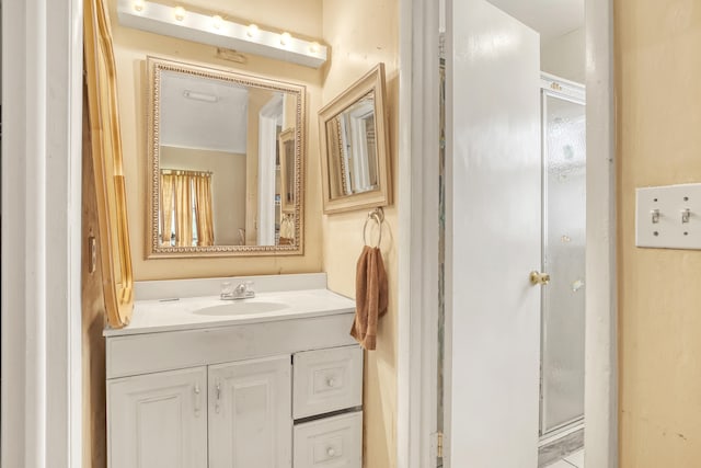 bathroom with vanity and walk in shower