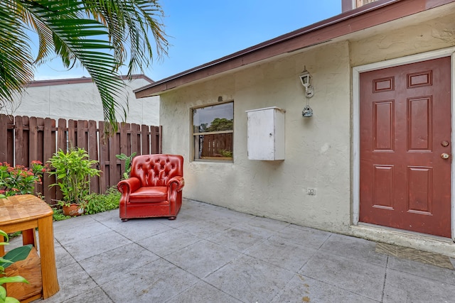 doorway to property with a patio area