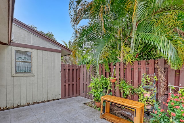 view of patio with an outbuilding