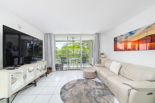 living room with a wall of windows and light tile patterned floors