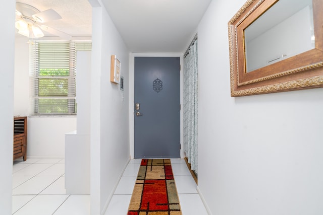 hallway featuring light tile patterned floors