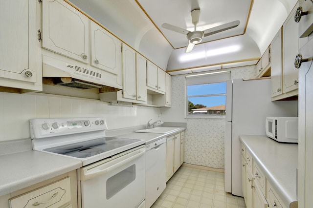 kitchen with white appliances, ceiling fan, and sink