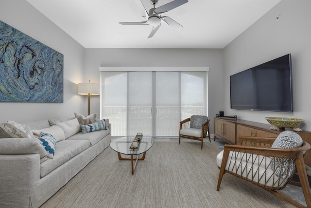 living room featuring carpet and ceiling fan