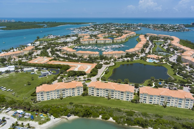 birds eye view of property with a water view