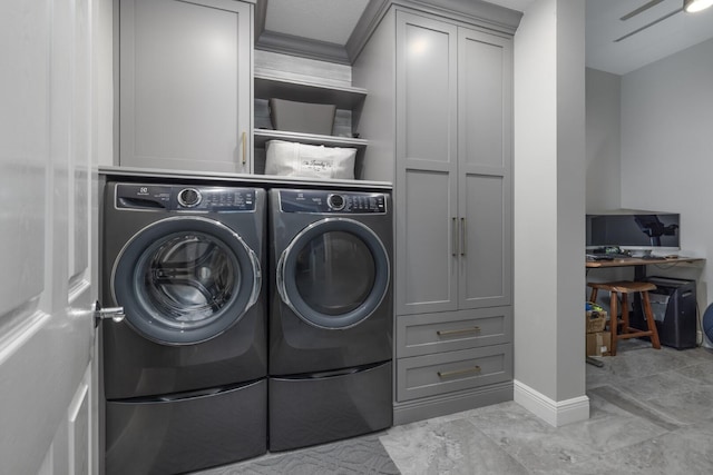 laundry area featuring cabinets and washer and clothes dryer