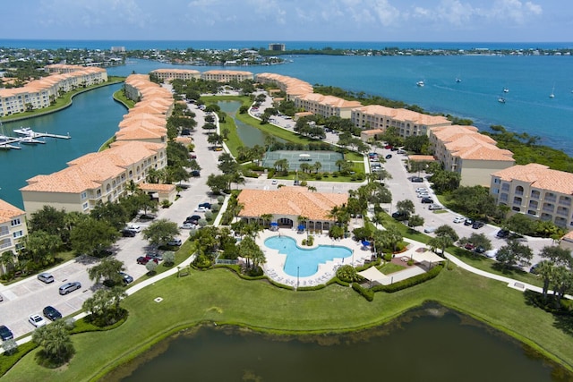 birds eye view of property with a water view