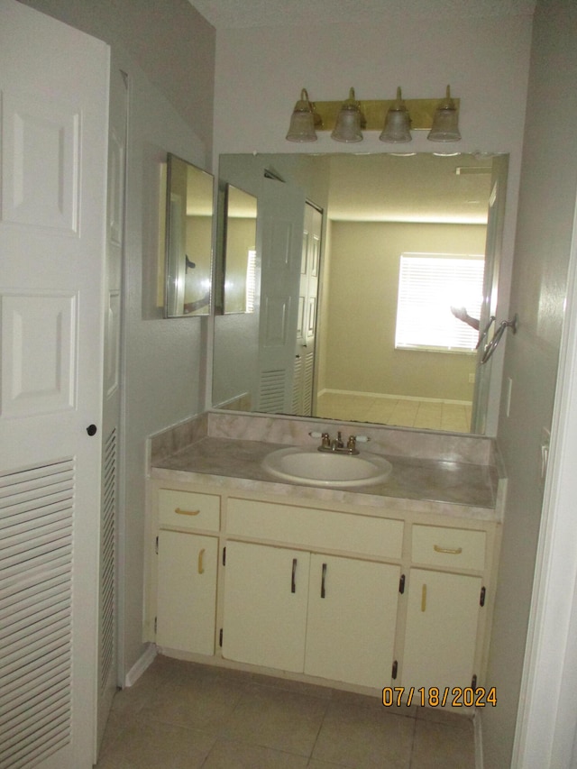 bathroom featuring vanity and tile patterned flooring