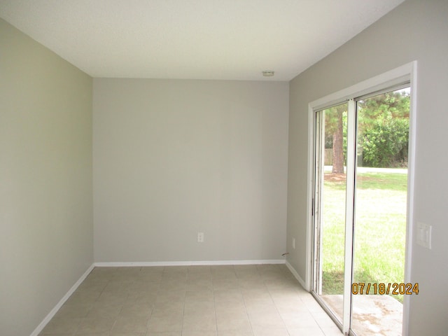 view of tiled spare room