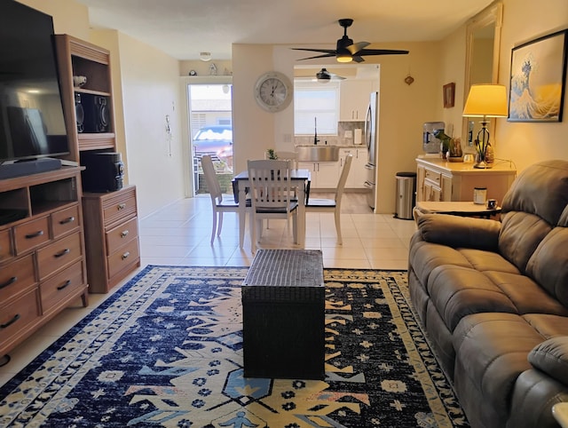 tiled living room with sink and ceiling fan