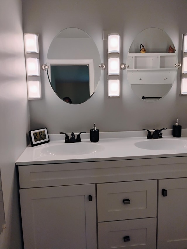 bathroom featuring dual bowl vanity