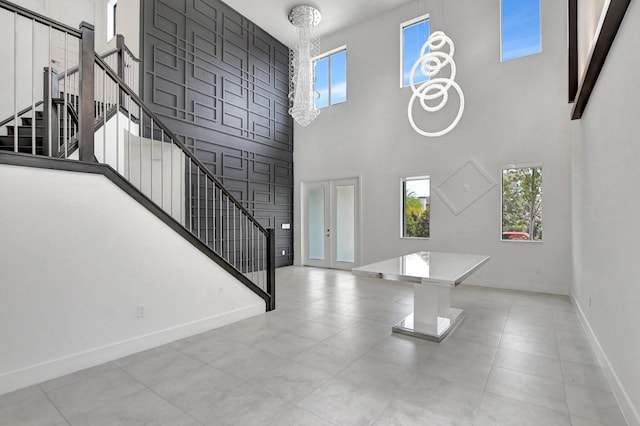 foyer featuring a high ceiling and light tile patterned floors