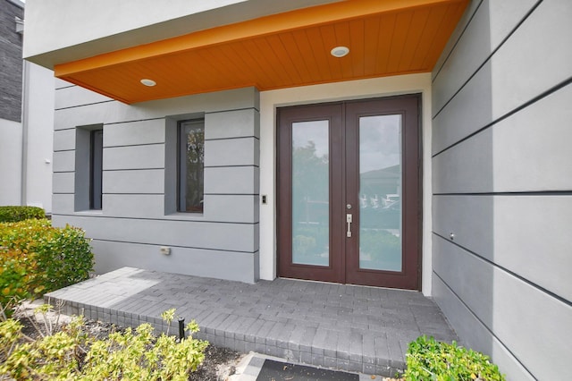 view of exterior entry featuring french doors