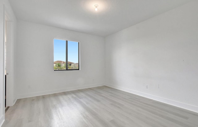 unfurnished room featuring light hardwood / wood-style floors