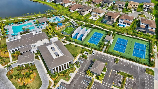 birds eye view of property with a water view