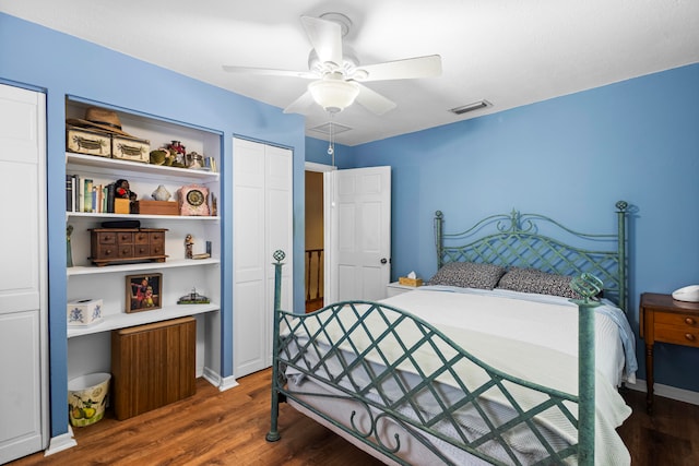 bedroom featuring dark hardwood / wood-style flooring, a closet, and ceiling fan