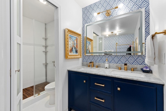 bathroom featuring vanity, walk in shower, backsplash, and toilet