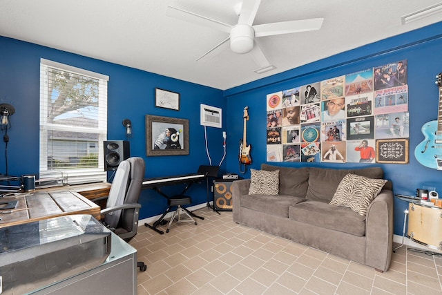 office featuring ceiling fan, a wall unit AC, and light tile patterned floors