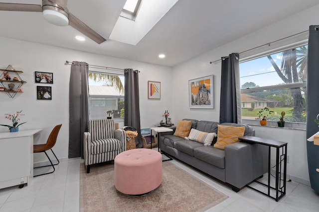 living room featuring a skylight