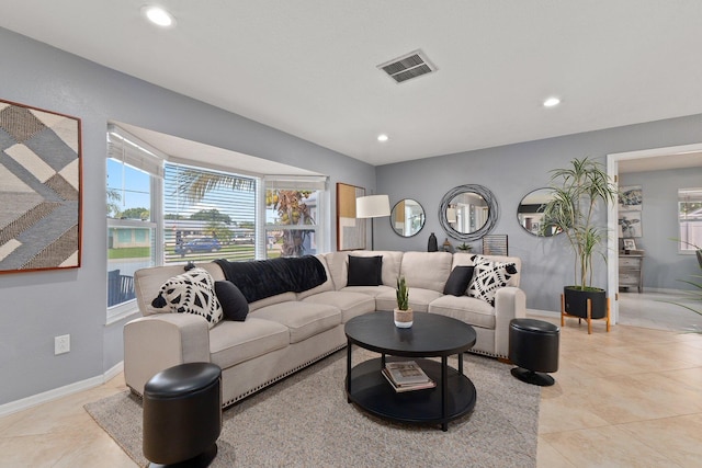 living room with light tile patterned floors