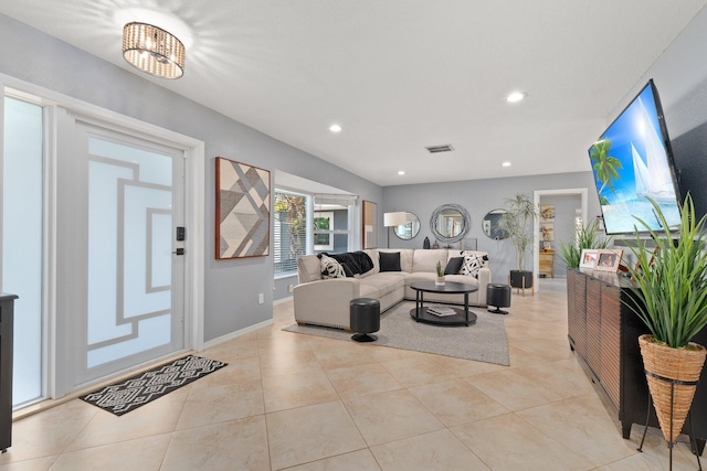 living room with light tile patterned flooring