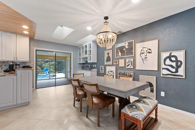 dining area featuring indoor bar and light tile patterned floors