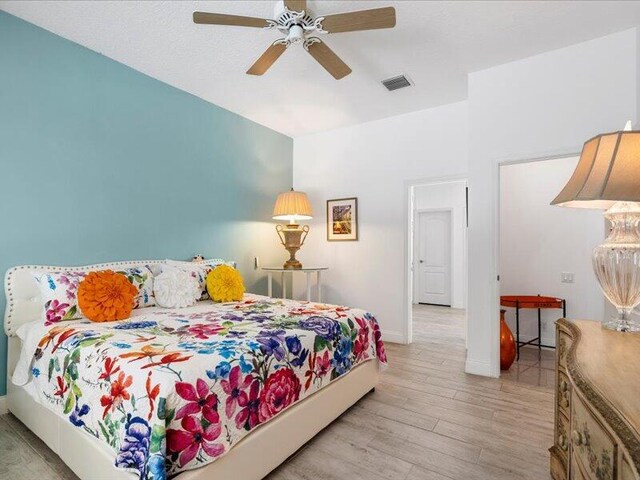 bedroom featuring ceiling fan and light wood-type flooring