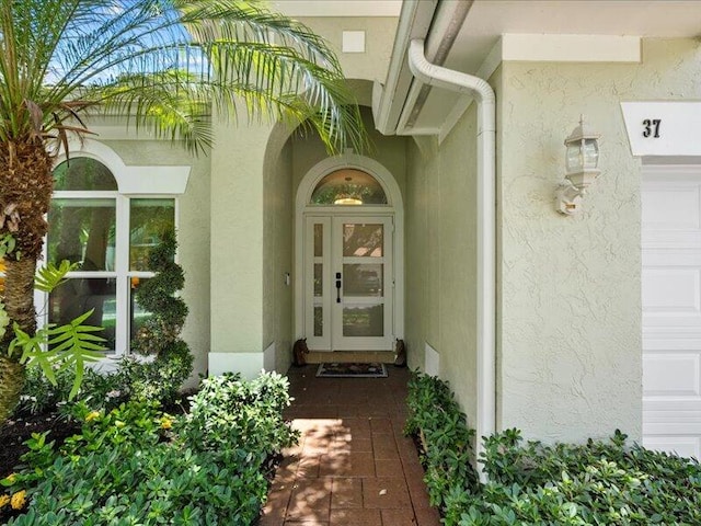 view of exterior entry featuring a garage