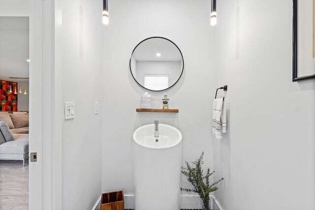 bathroom featuring sink and hardwood / wood-style flooring