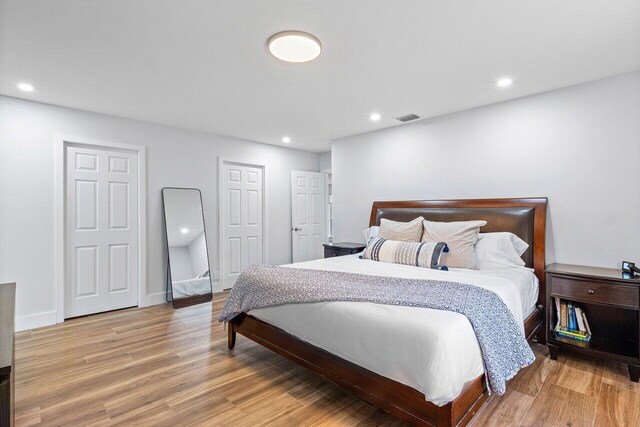 bedroom with light hardwood / wood-style floors