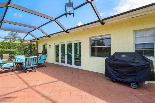 sunroom / solarium featuring french doors