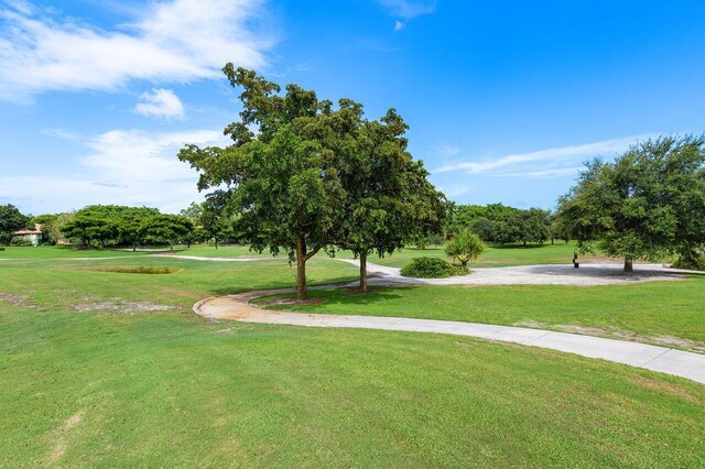 view of property's community with a lawn