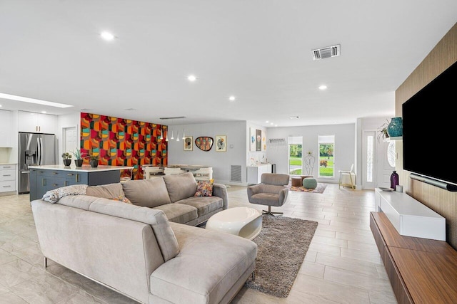 living room with light tile patterned flooring