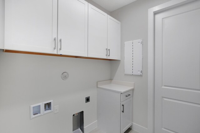 washroom featuring washer hookup, hookup for an electric dryer, and cabinets