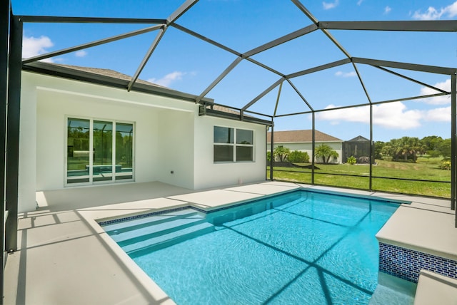 view of swimming pool featuring a lanai and a patio